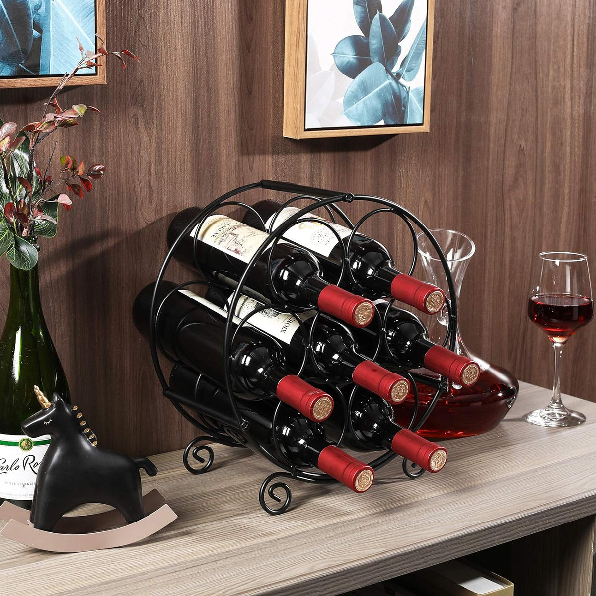 Angled close-up of the circular metal wine rack displaying bottles stored horizontally on a tabletop