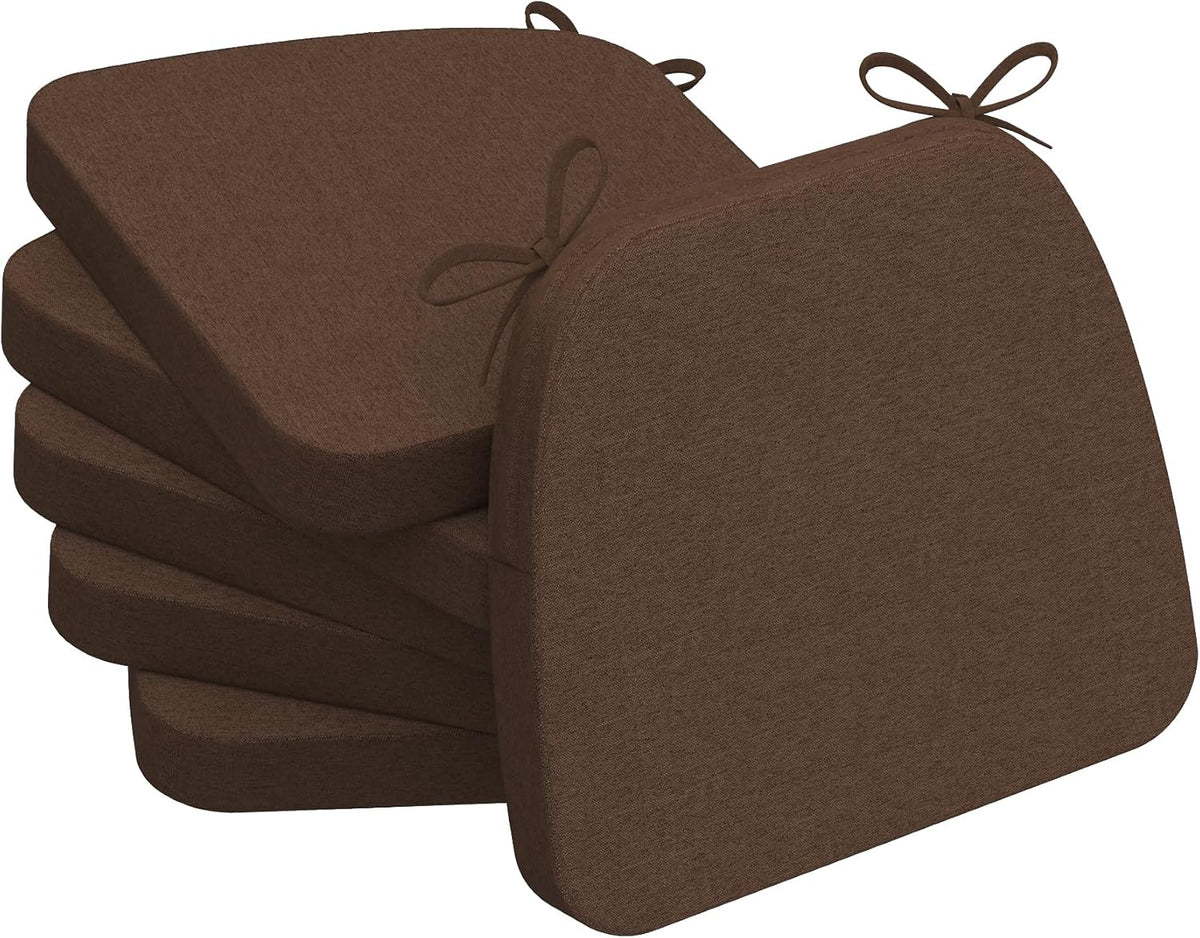 Stack of four chocolate-brown D-shaped chair cushions seen from a left rear angle with visible tie loops.