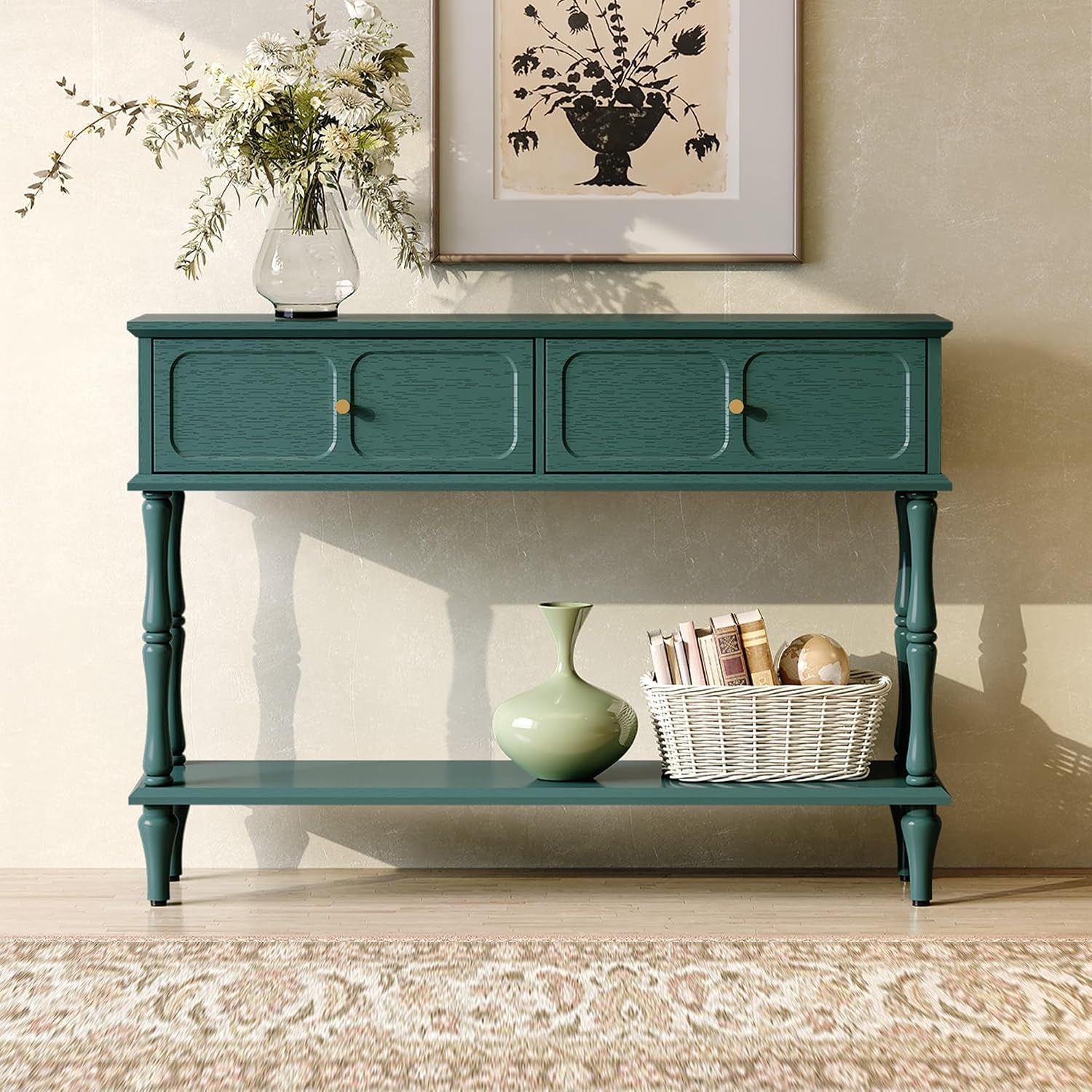 Front view of a teal mid‑century console table with turned legs, framed botanical print above and decorative items on shelf