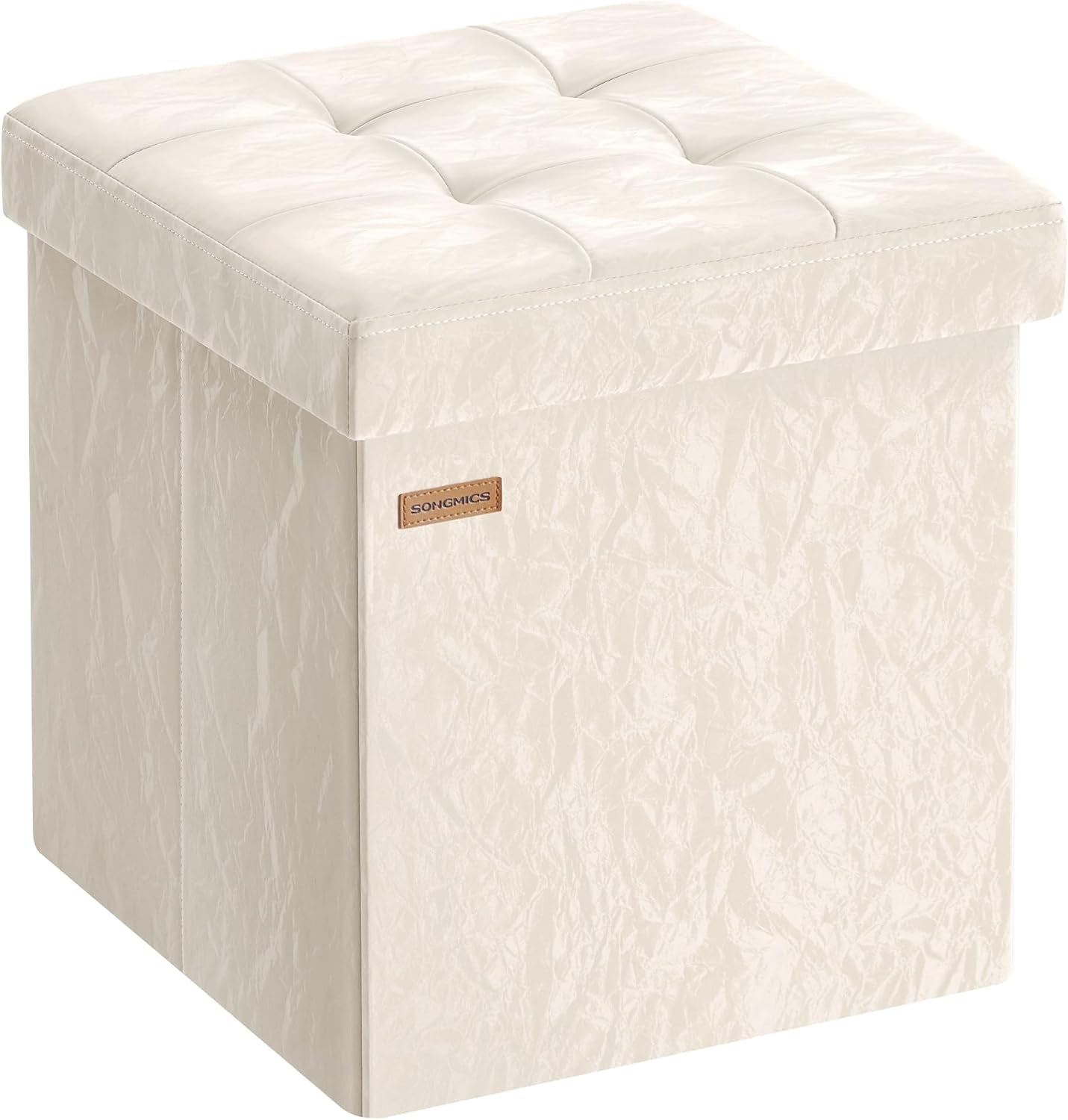 Cream tufted square storage ottoman shown at a three-quarter angle on a white background.