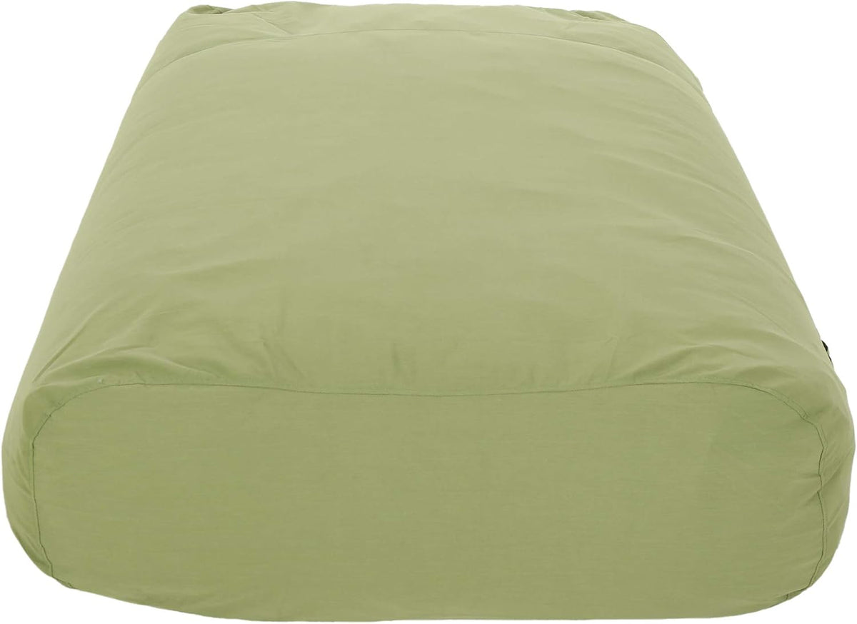 Straight-on view of the lounger’s rounded short end in olive green.