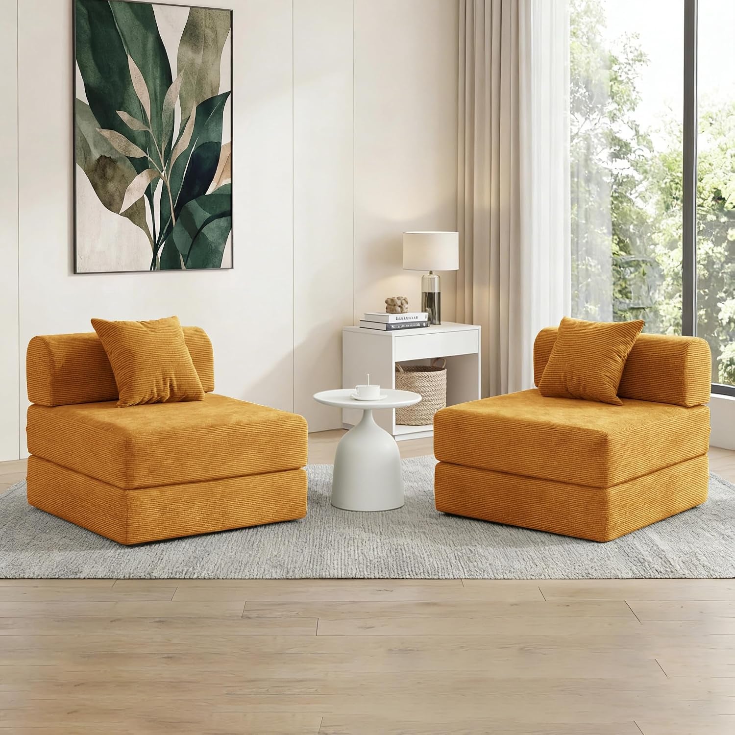 Two mustard corduroy folding chairs facing each other with a small white table between them