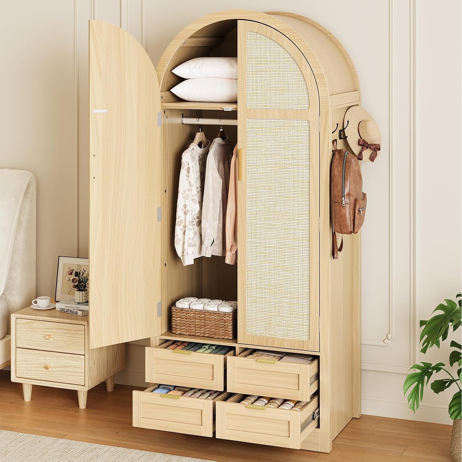 Natural finish arched wardrobe with rattan doors open, four drawers pulled out and hanging clothes inside