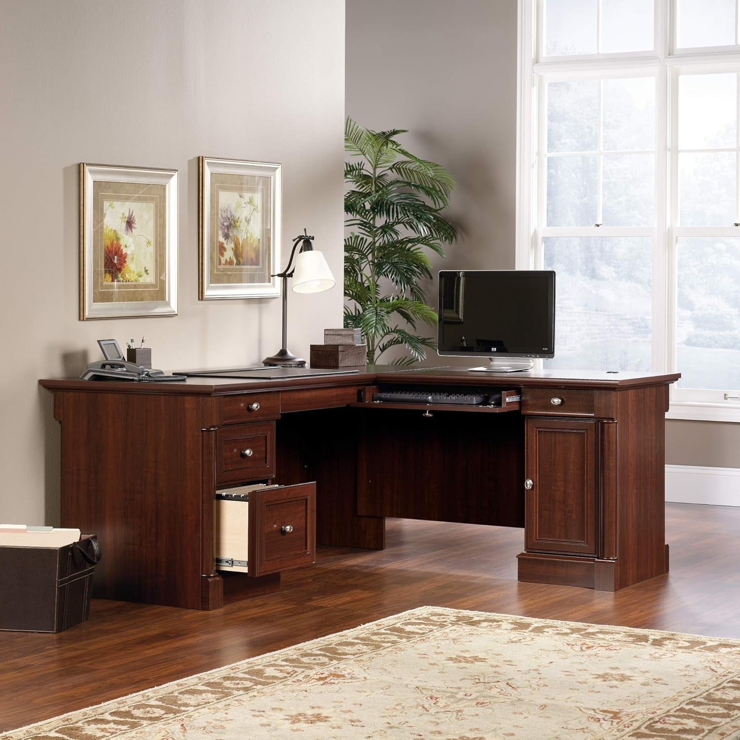 Desk showing flip-down keyboard/laptop panel extended and lower file drawer open with hanging-file storage