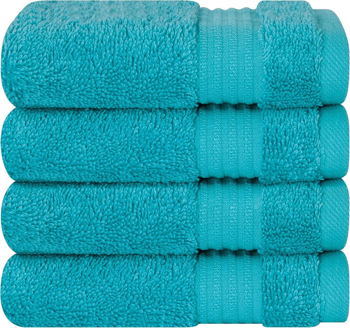 Stack of four folded turquoise bath towels showing textured loops and ribbed band