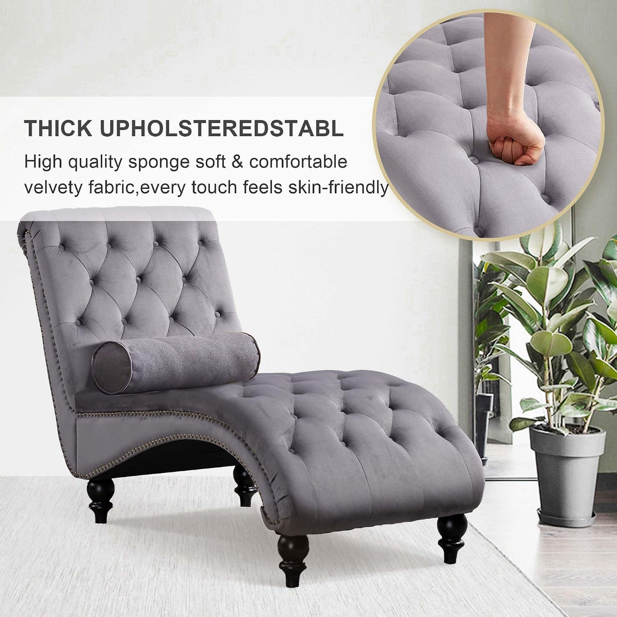 Grey chaise lounge with tufted upholstery and nailhead trim, side angle