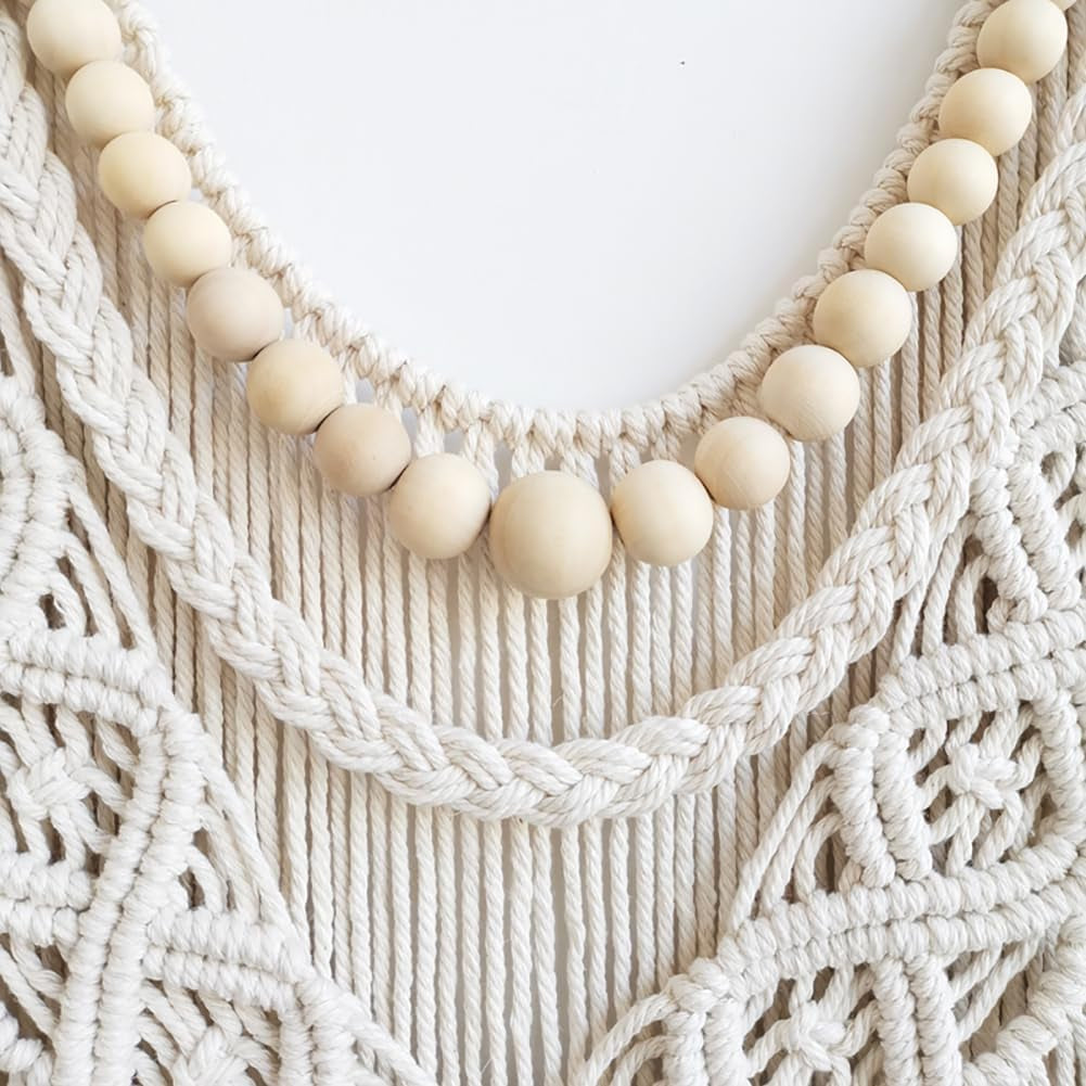 Close-up of wooden beads and braided cotton knots on ivory macrame
