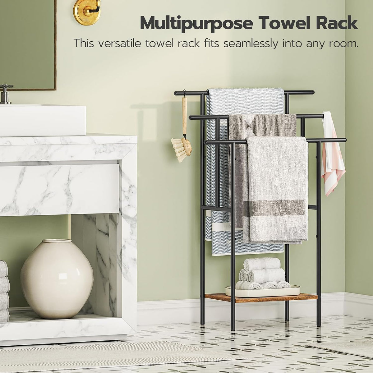 Black metal towel rack positioned beside a marble console, showing three tiers and a wood-tone shelf.
