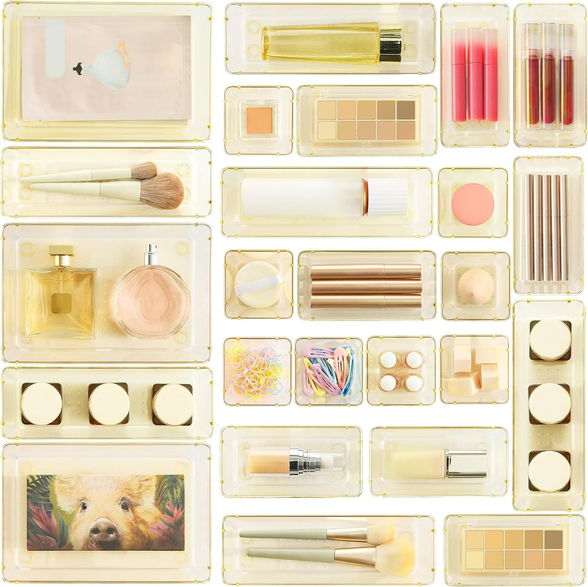 Top-down, tightly cropped layout of gold-tinted small trays each containing single cosmetics and accessories.
