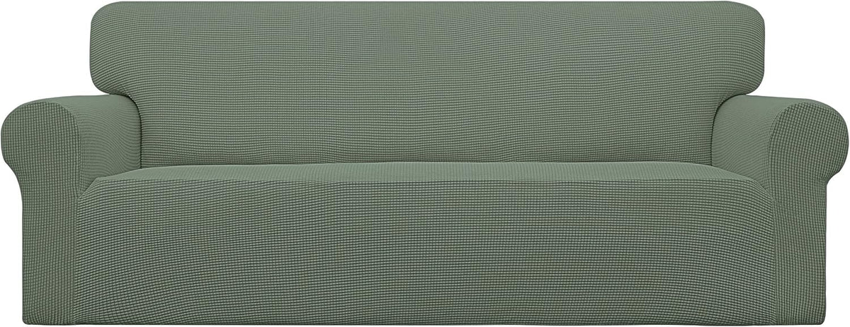 Front view of a three-seat sofa wrapped in a textured sage green stretch slipcover