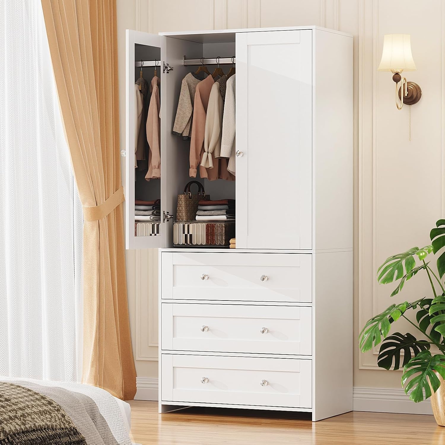Single tall white wardrobe with one mirrored door open, hanging clothes and folded items on shelf above drawers.