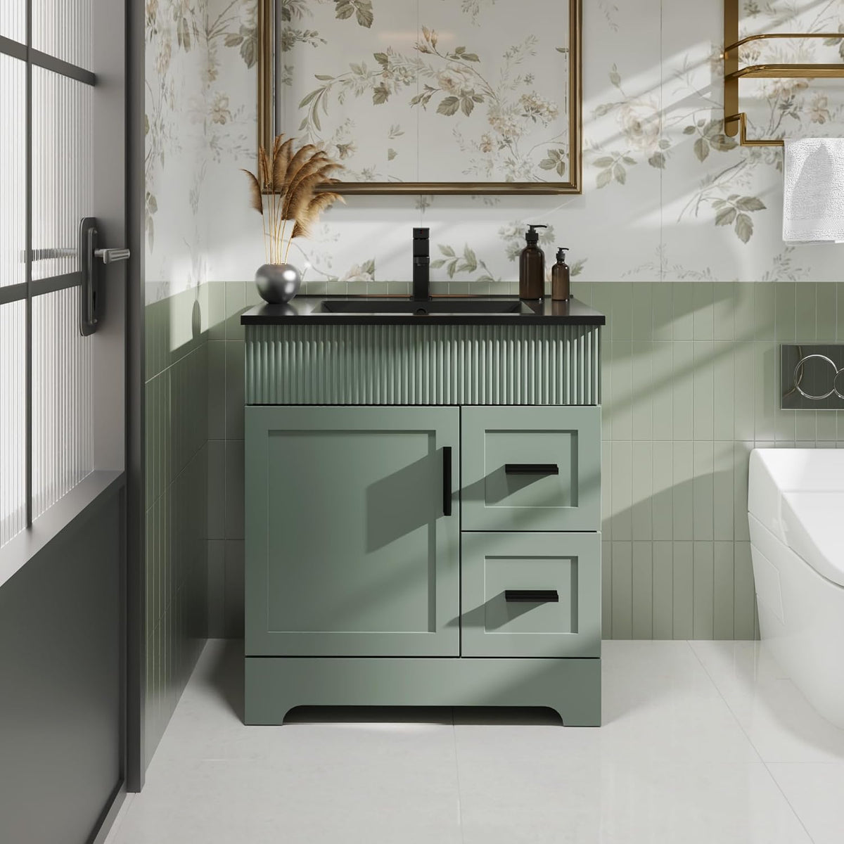 Close front view of green vanity showing fluted top panel, black faucet and two stacked drawers at right.