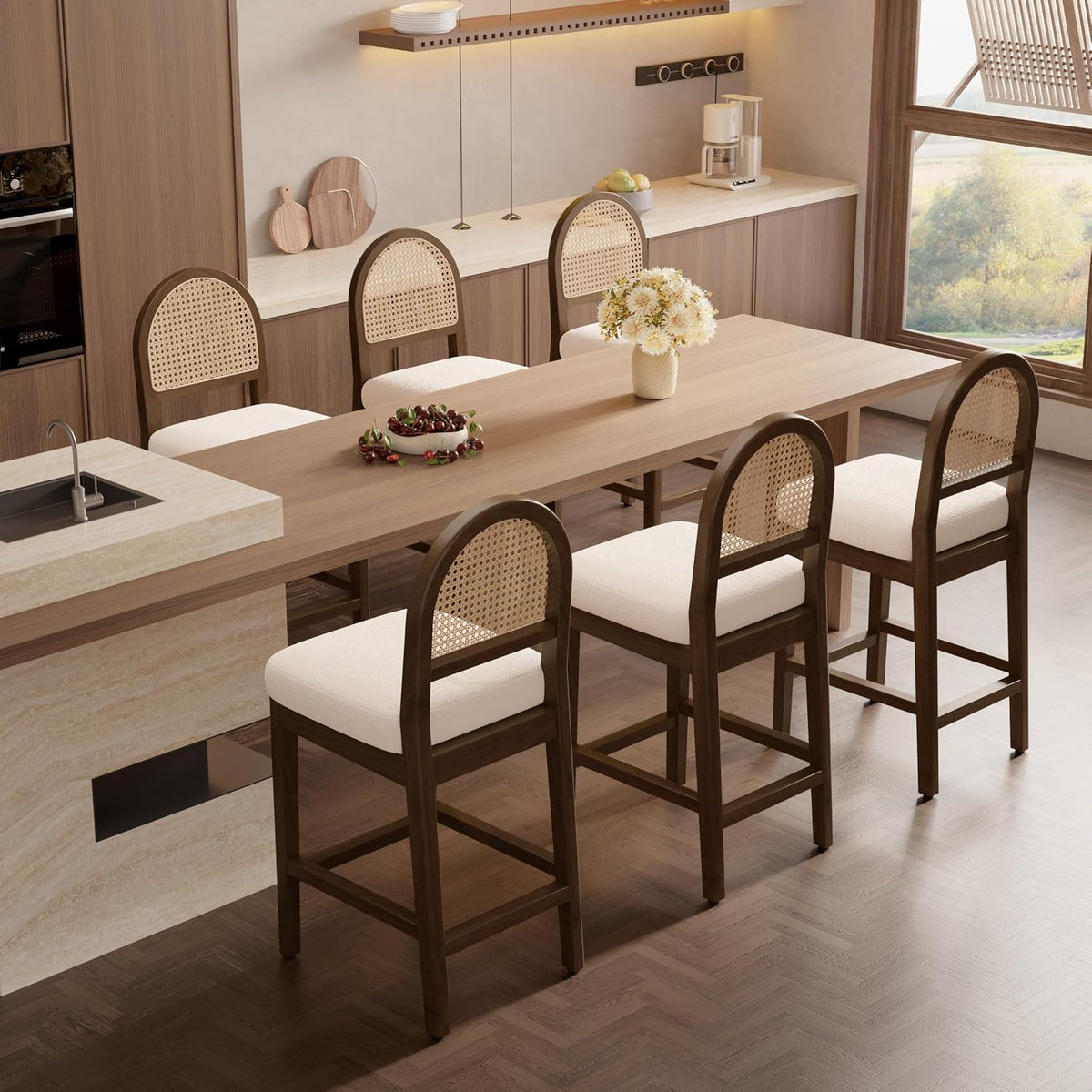 Row of dark-wood rattan-back counter stools along a long wooden table and island