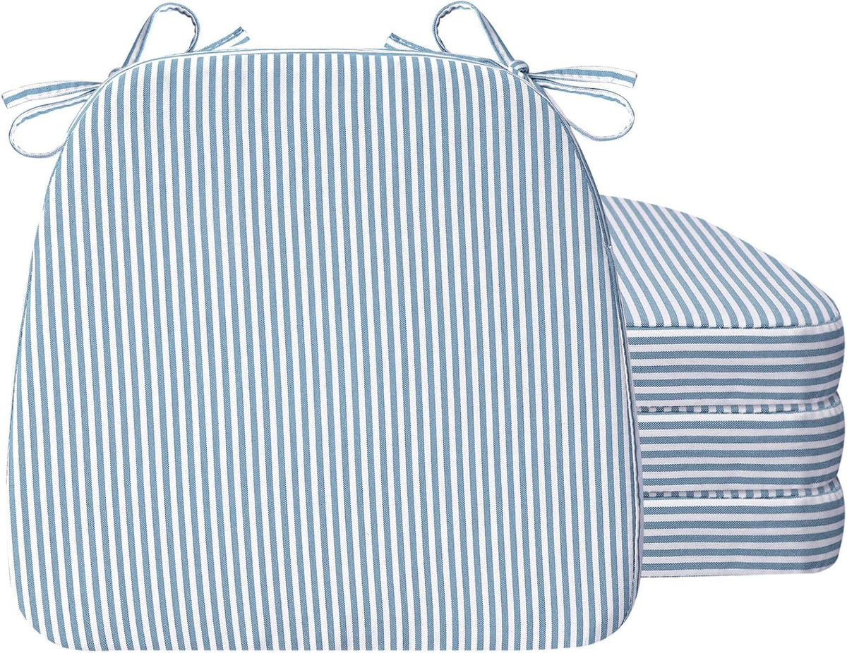 D-shaped chair cushion in blue-and-white vertical stripes with ties, stacked cushions visible behind