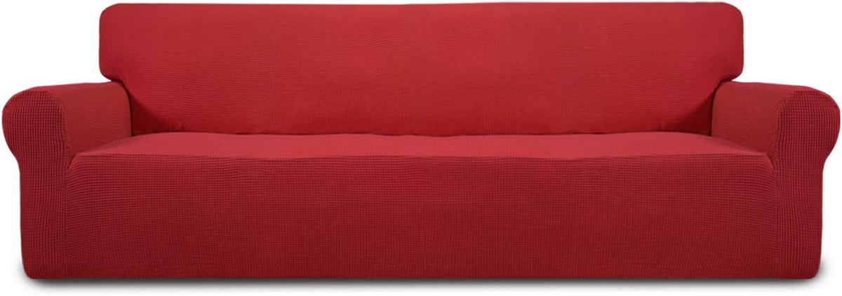 Low-angle studio shot of a three-seat sofa in bright red textured slipcover on a white background.
