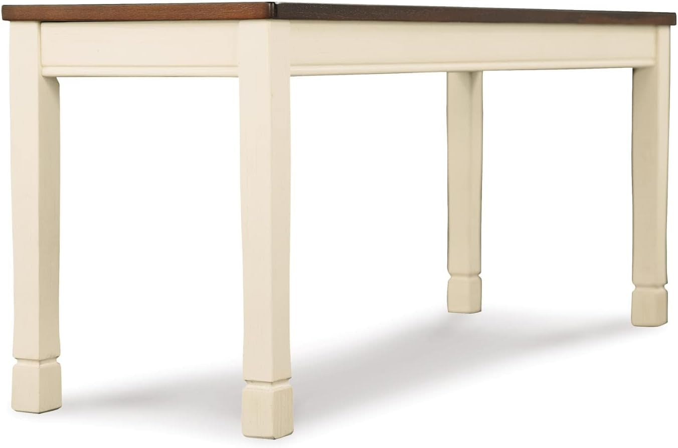 Angled rear three-quarter view of the backless bench showing the burnished brown seat top and painted frame on a white studio