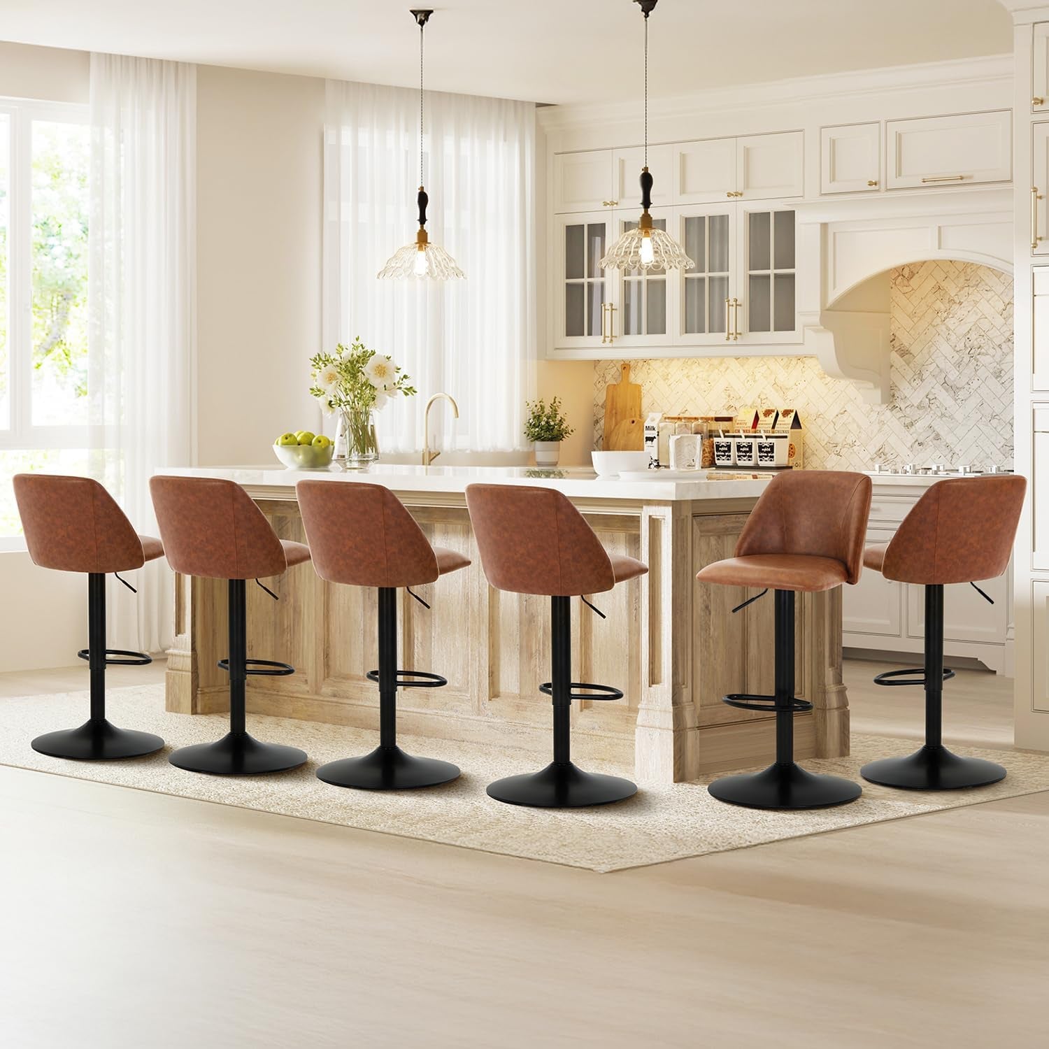 Six tan-brown swivel bar stools lined along a kitchen island with black pedestal bases