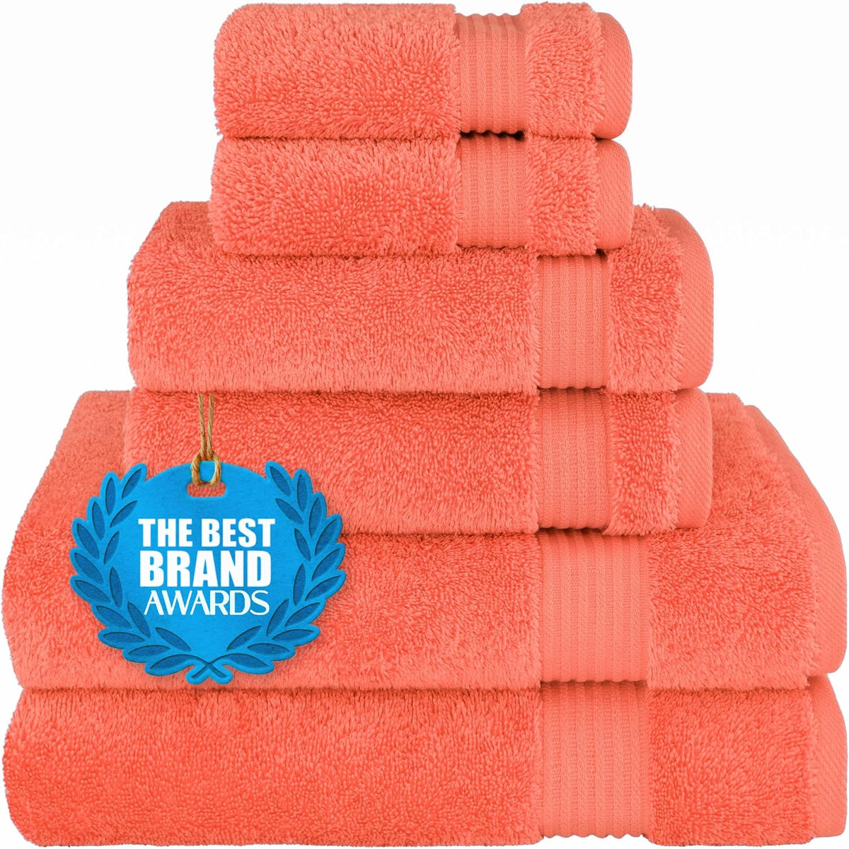Stack of coral-orange towels with a blue award tag displayed on the lower towel