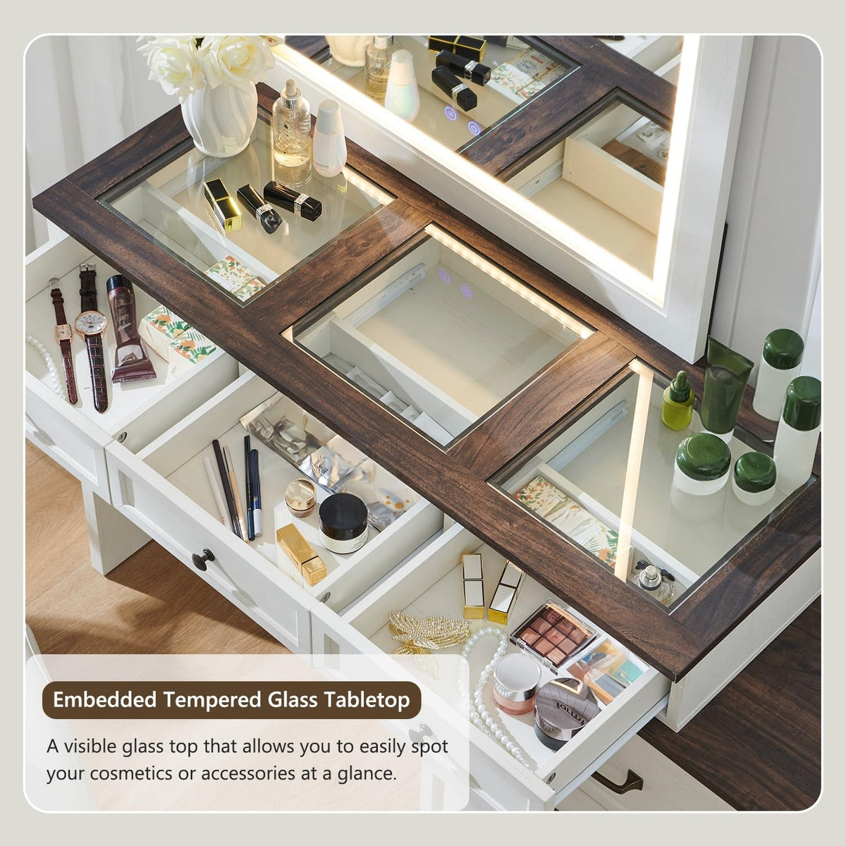 Close-up of embedded tempered glass tabletop with divided display compartments holding cosmetics
