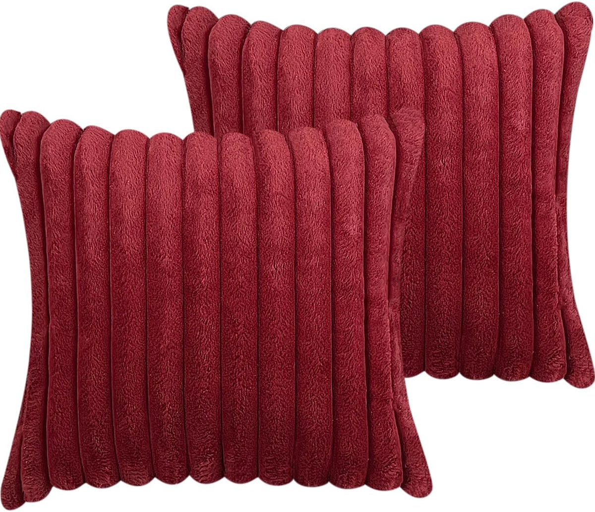 Two red faux-fur pillow covers shown stacked, featuring plush vertical tubular ribs