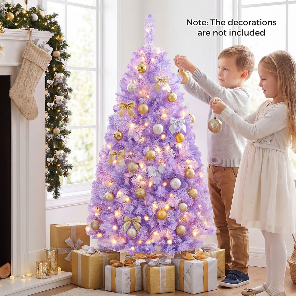 Lavender Christmas tree glowing with warm lights as two children hang ornaments beside wrapped gifts.