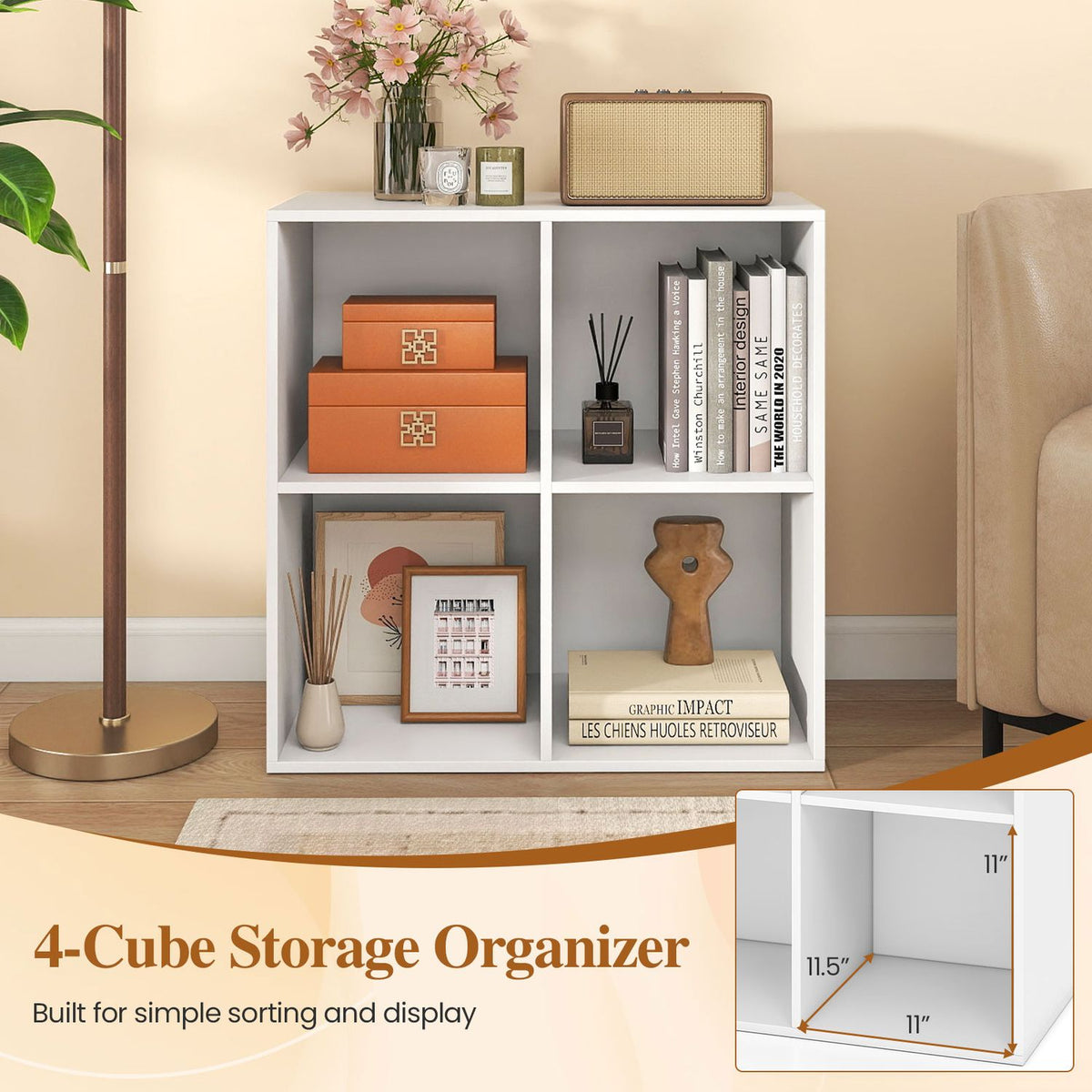 White four-cube bookshelf styled with books and decor beside a floor lamp and armchair.
