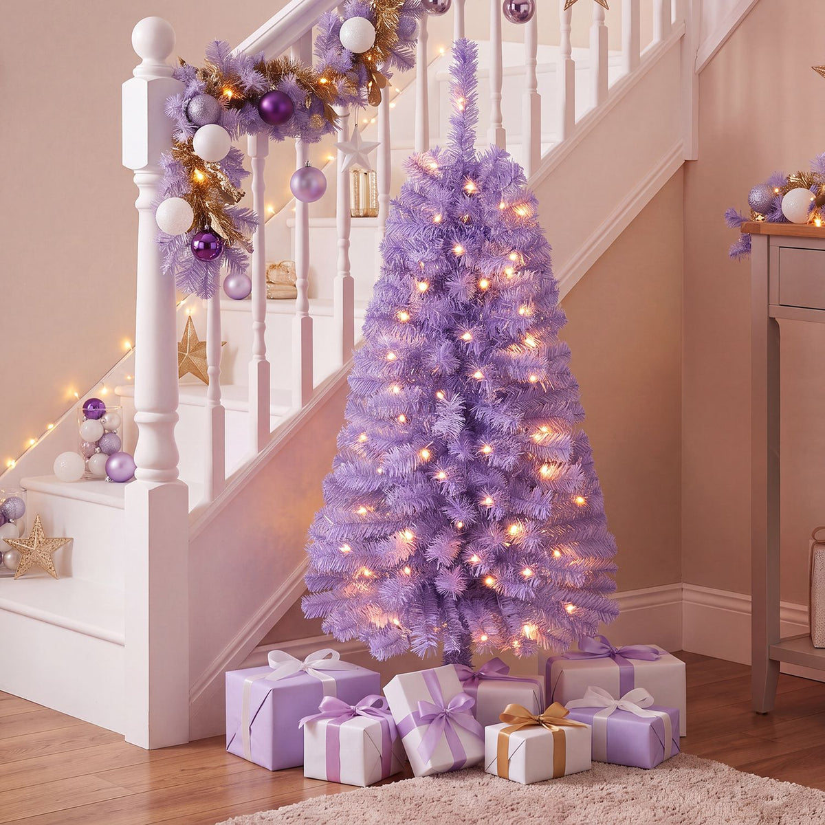 A purple Christmas tree with glowing warm lights stands beside a decorated staircase, surrounded by wrapped gifts.