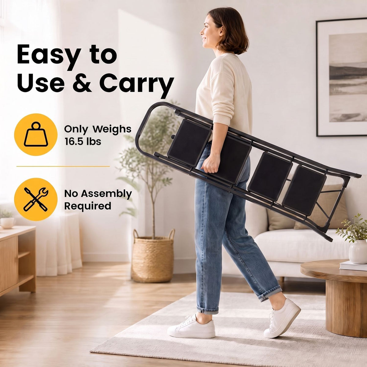 A woman carries the folded black ladder horizontally through a bright living room.