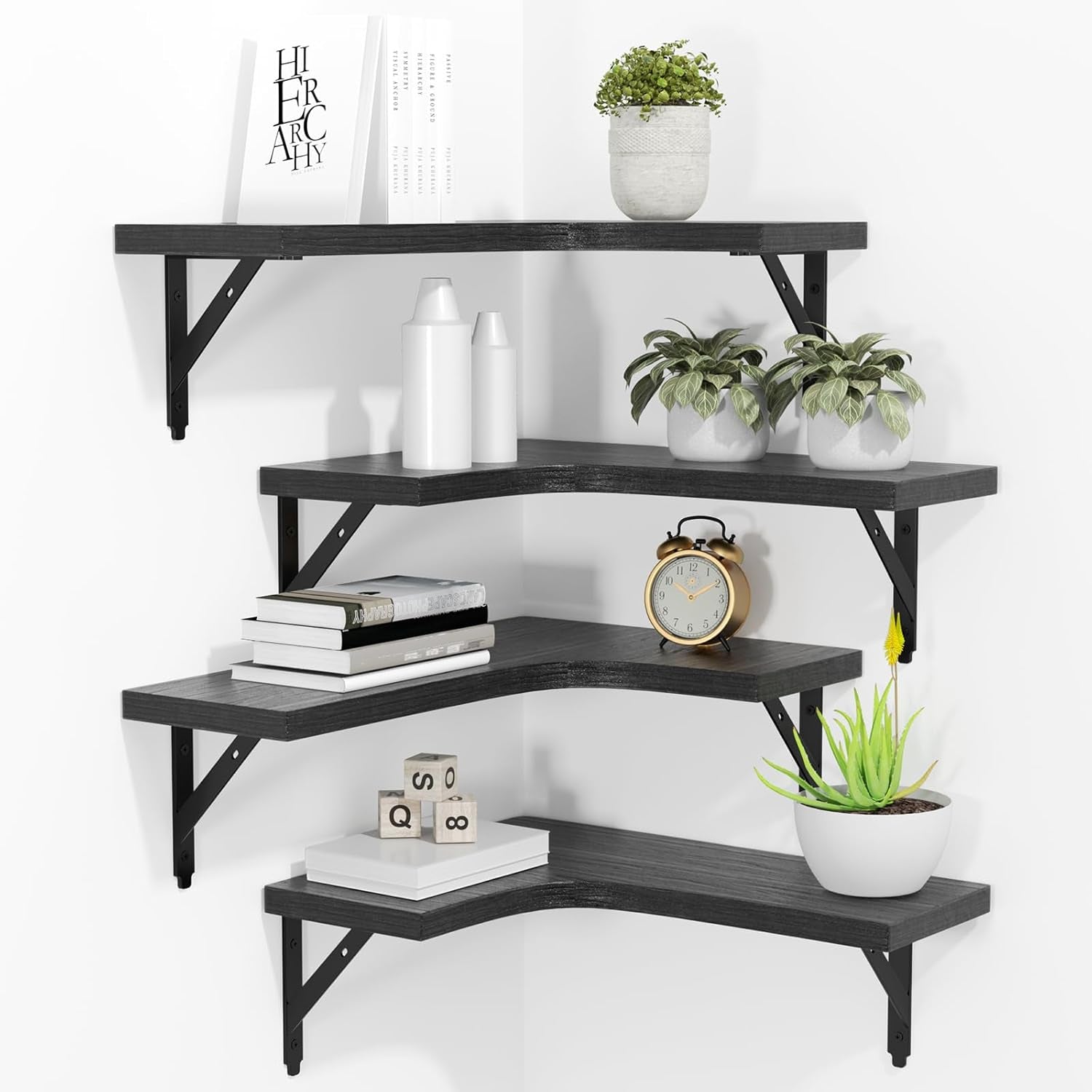Black L-shaped corner floating shelves mounted with decor and angled front view