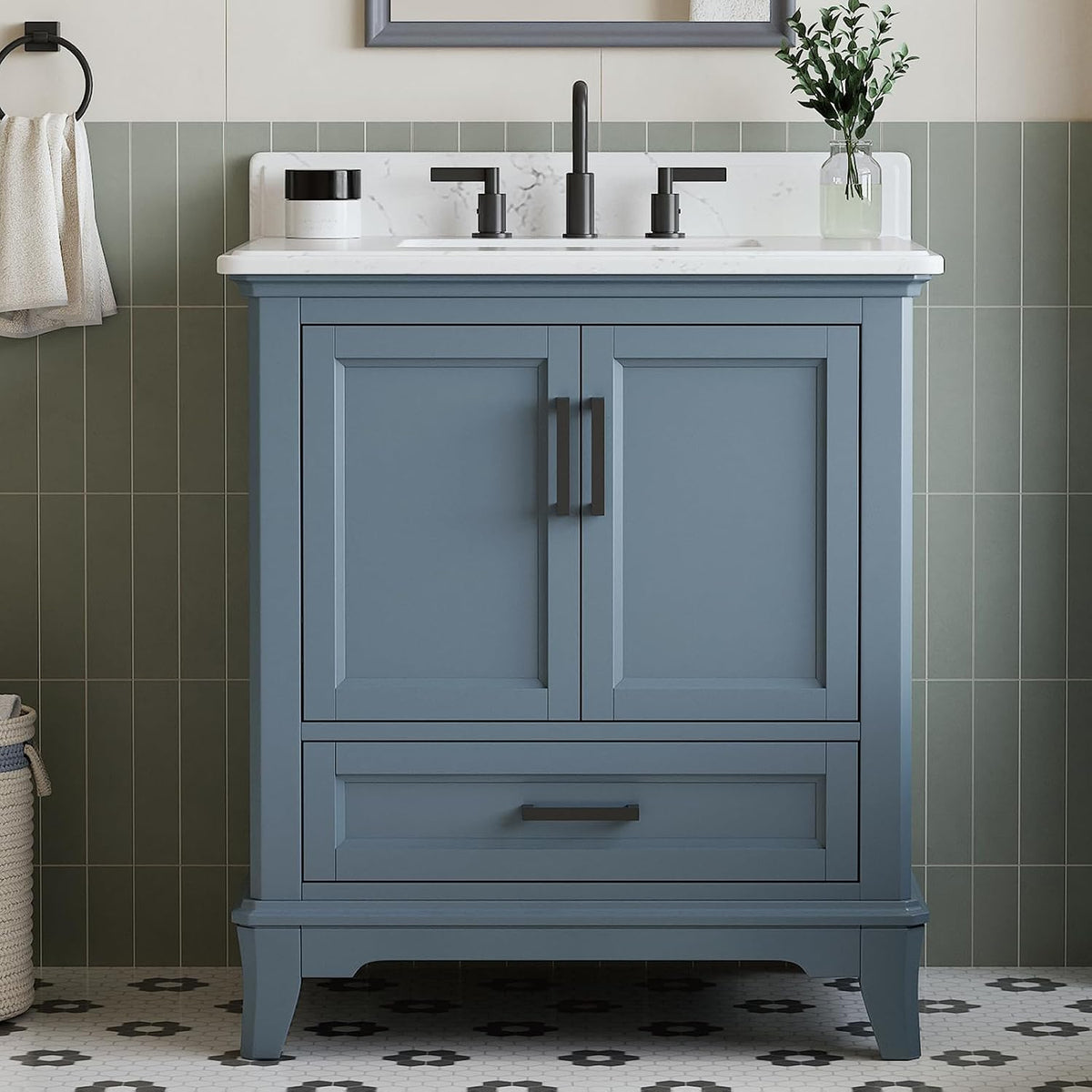 Close front view of a steel-blue vanity showing doors, lower drawer and black pull