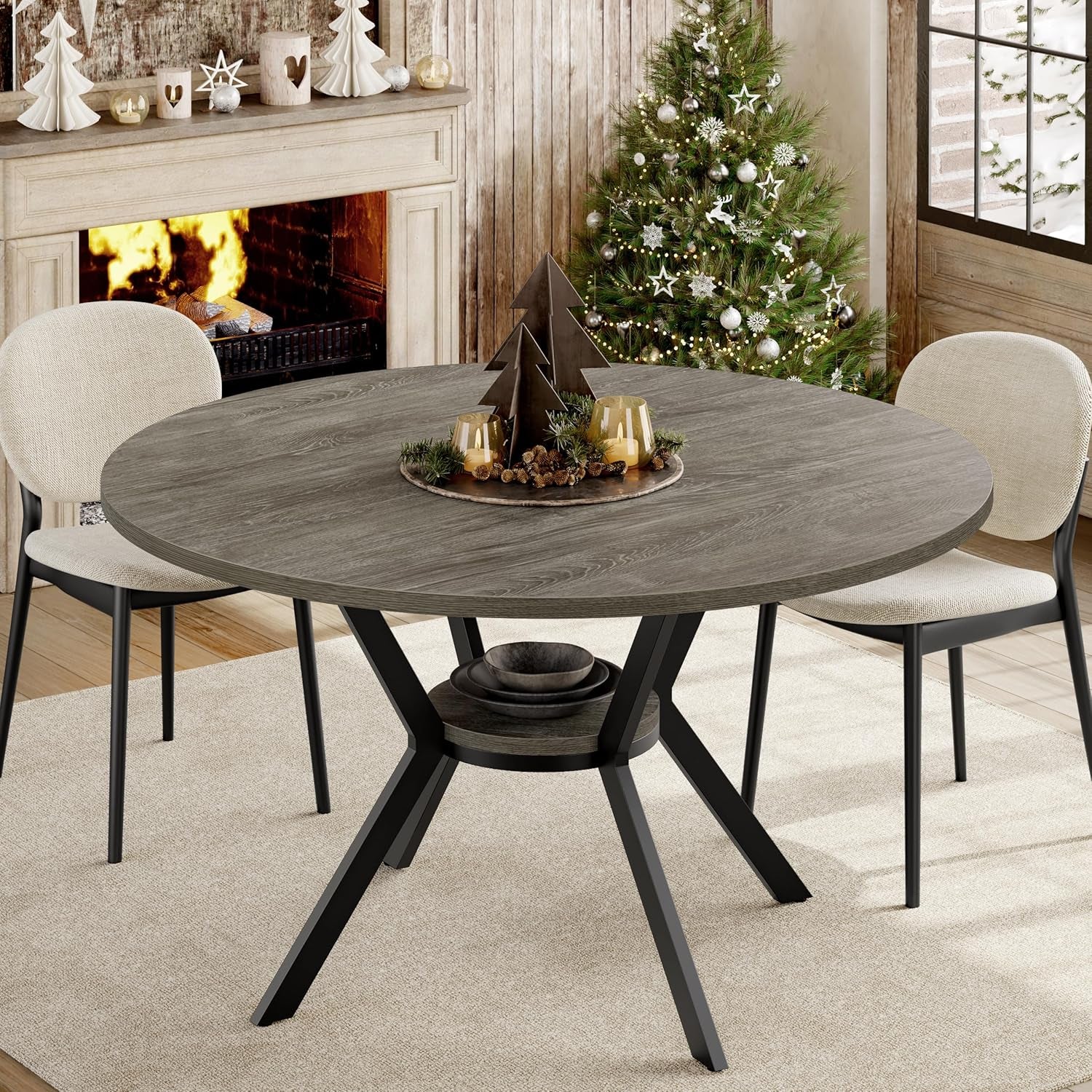 Close view of round gray tabletop with black metal legs and lower shelf, staged in a cozy holiday scene.