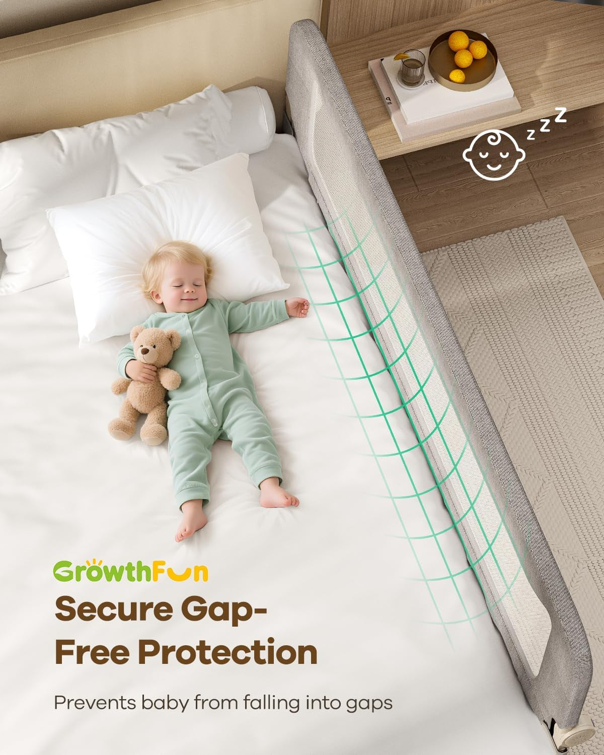 Overhead view of a toddler sleeping beside the installed rail with a bedside table and safety grid overlay.