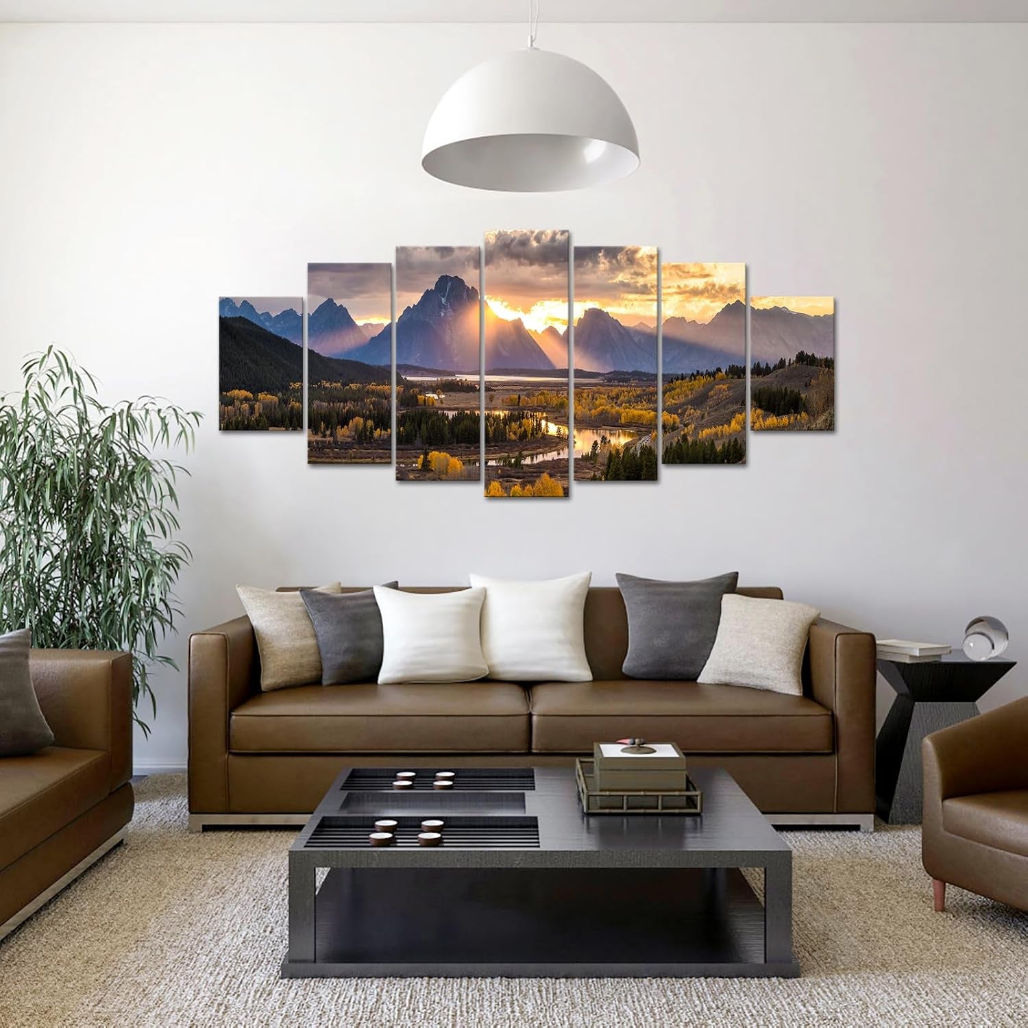 Seven-piece autumn Grand Teton canvas mounted above a brown sofa in a modern living room setting