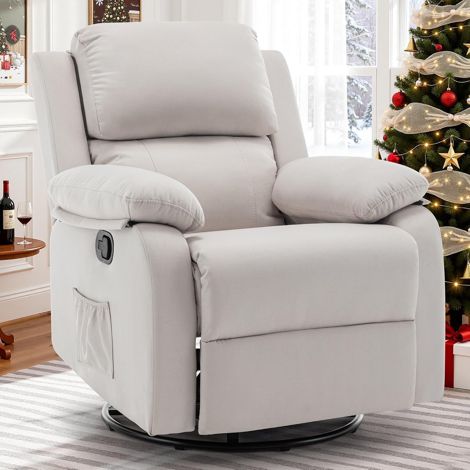 Light gray upholstered swivel recliner in a decorated living room near a Christmas tree.