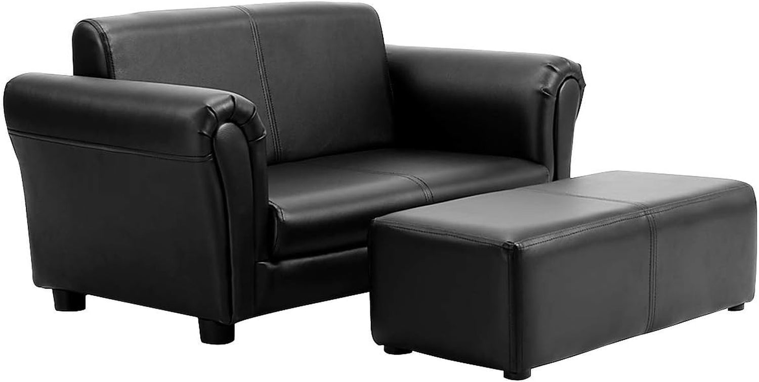 Clean studio cutout of the black two-seat sofa with matching ottoman on a white background.