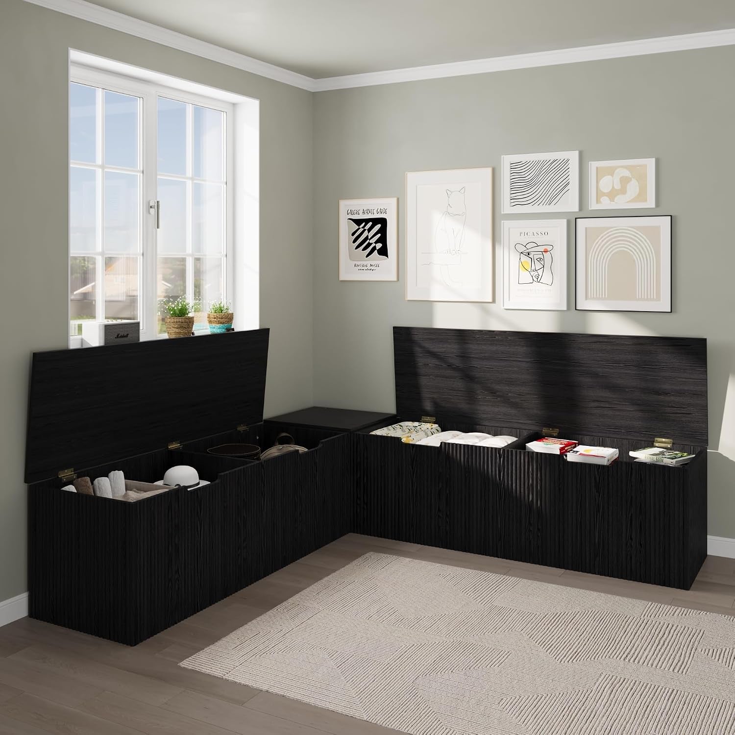 L-shaped bench with two seat lids open to reveal three interior storage compartments in a corner setting
