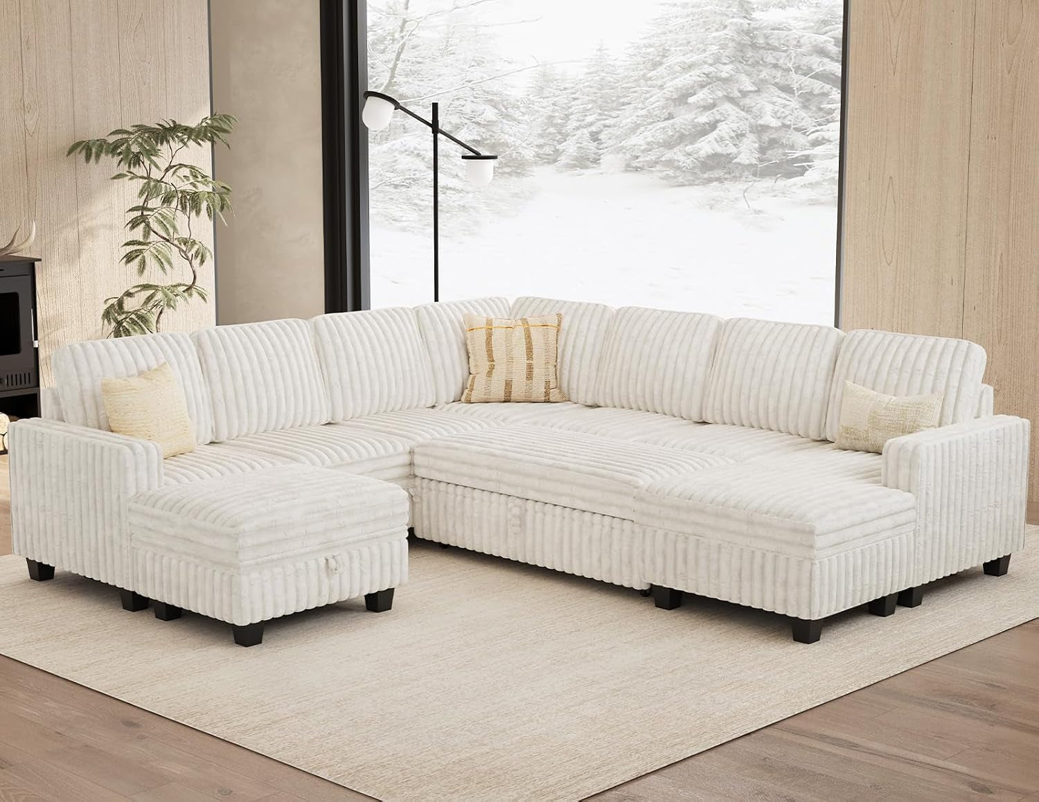 Large white corduroy sectional arranged in an L-shaped corner against a snowy window backdrop