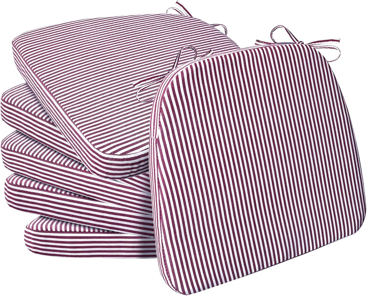 Four maroon-and-white narrow-striped D-shaped seat cushions, one propped forward to show stripes and ties