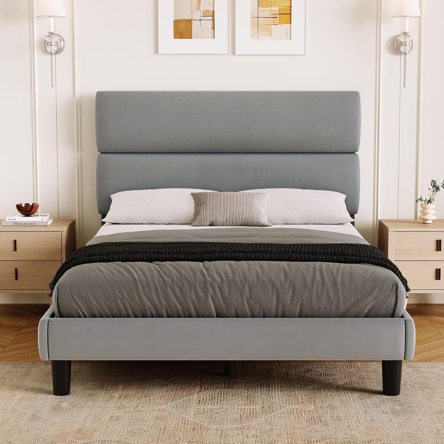 Centered bedroom view of a gray bed with an upholstered footboard and split horizontal headboard.