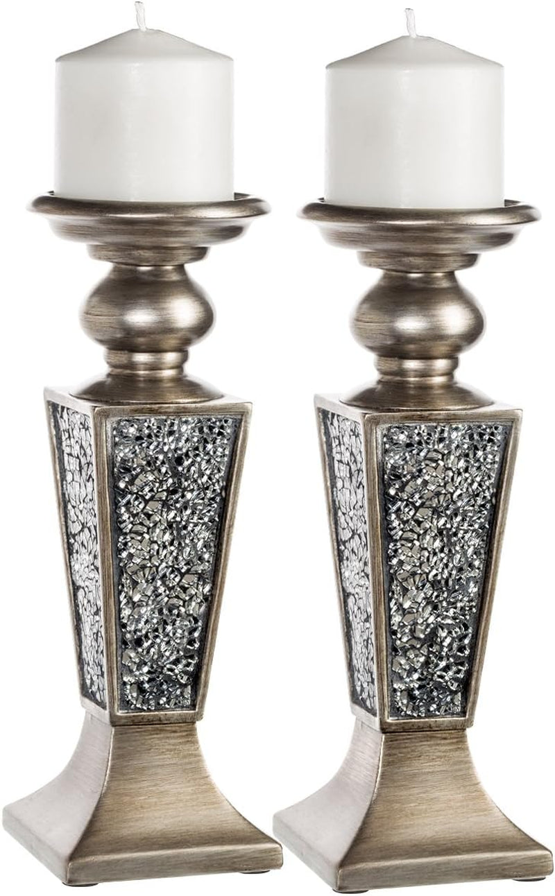 Pair in a silver finish showing reflective crackled mosaic panels and white pillar candles on top