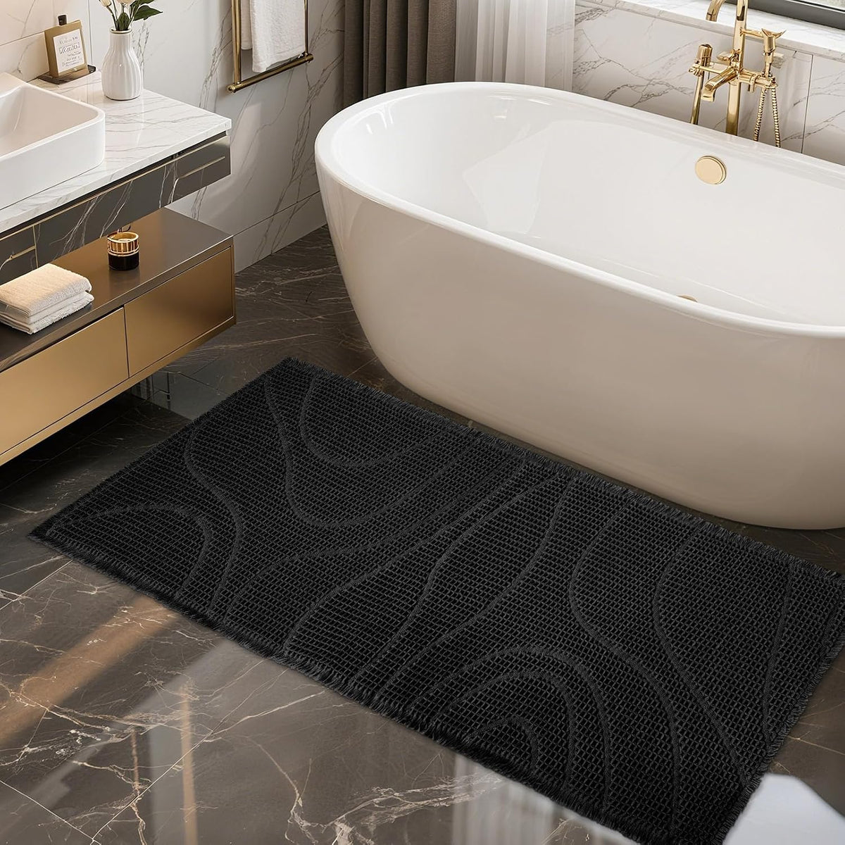 Black rectangular mat with raised wavy texture positioned beside a white freestanding bathtub.