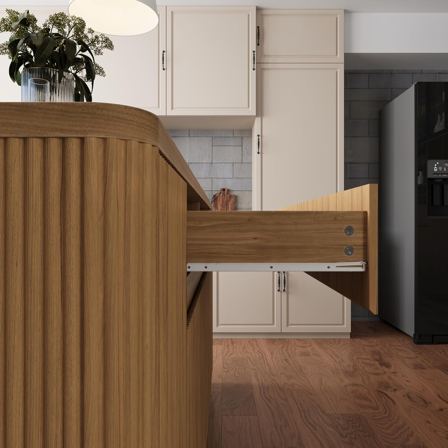 Close-up of a pull-out drawer and metal slide hardware on the wood-grain island