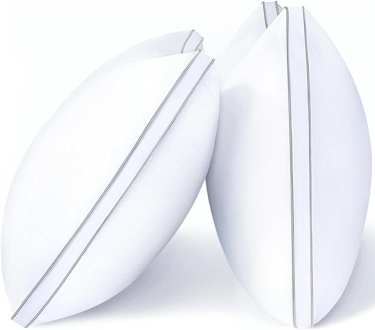 Three pillows arranged standing and leaning to show narrow piped seams and rounded edges