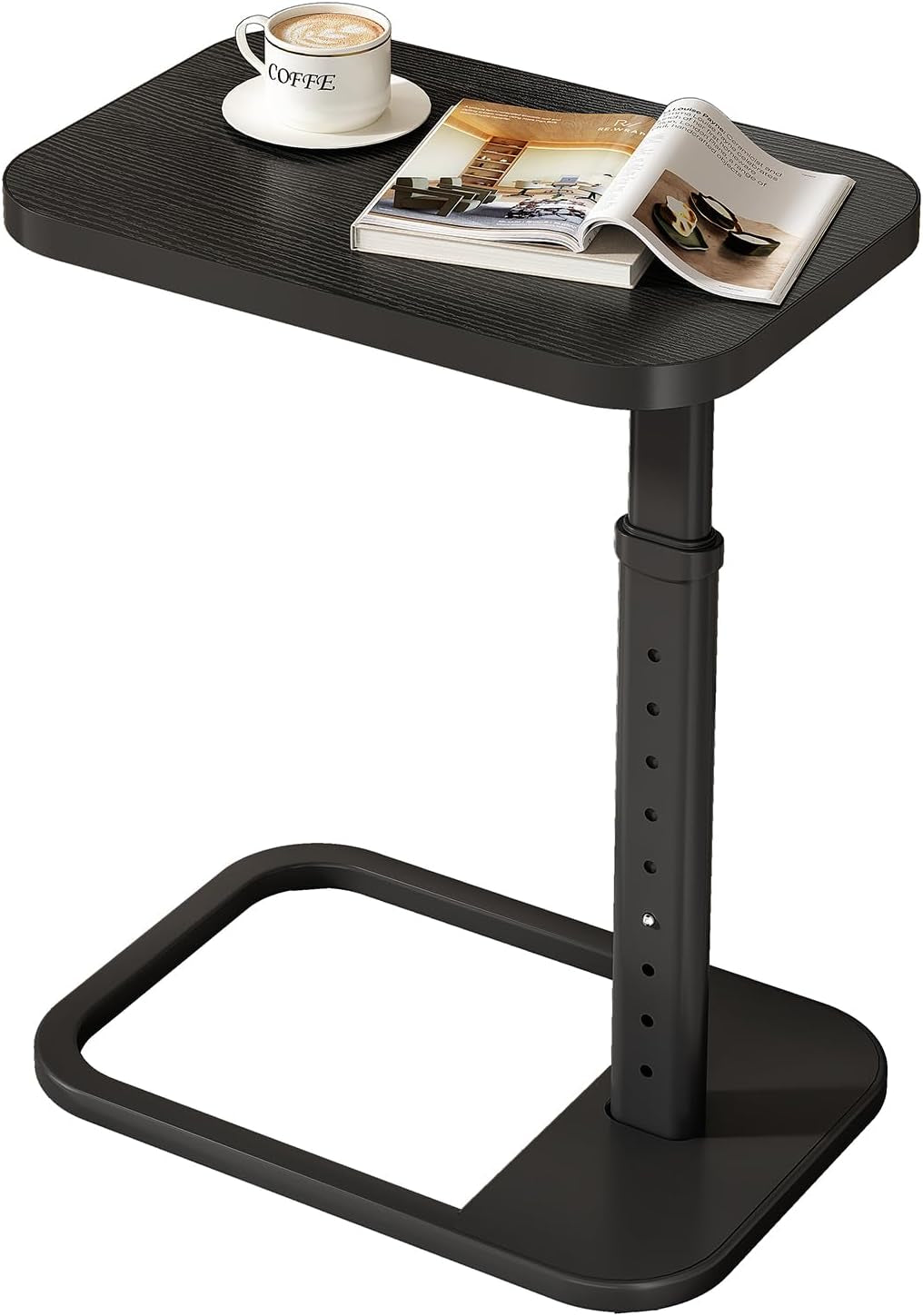 C-shaped end table with dark wood-grain top, black metal adjustable post and open rectangular C-base with cup and book on