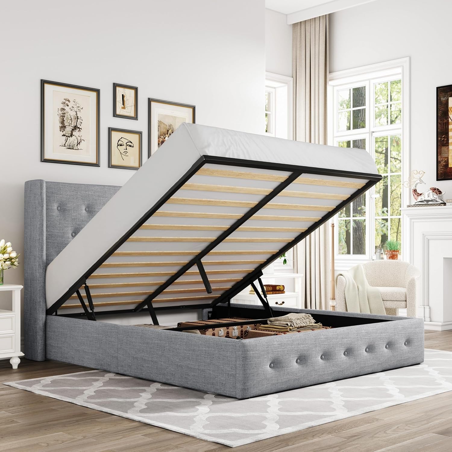 Light gray tufted storage bed with gas-lift mattress frame raised to reveal storage space.