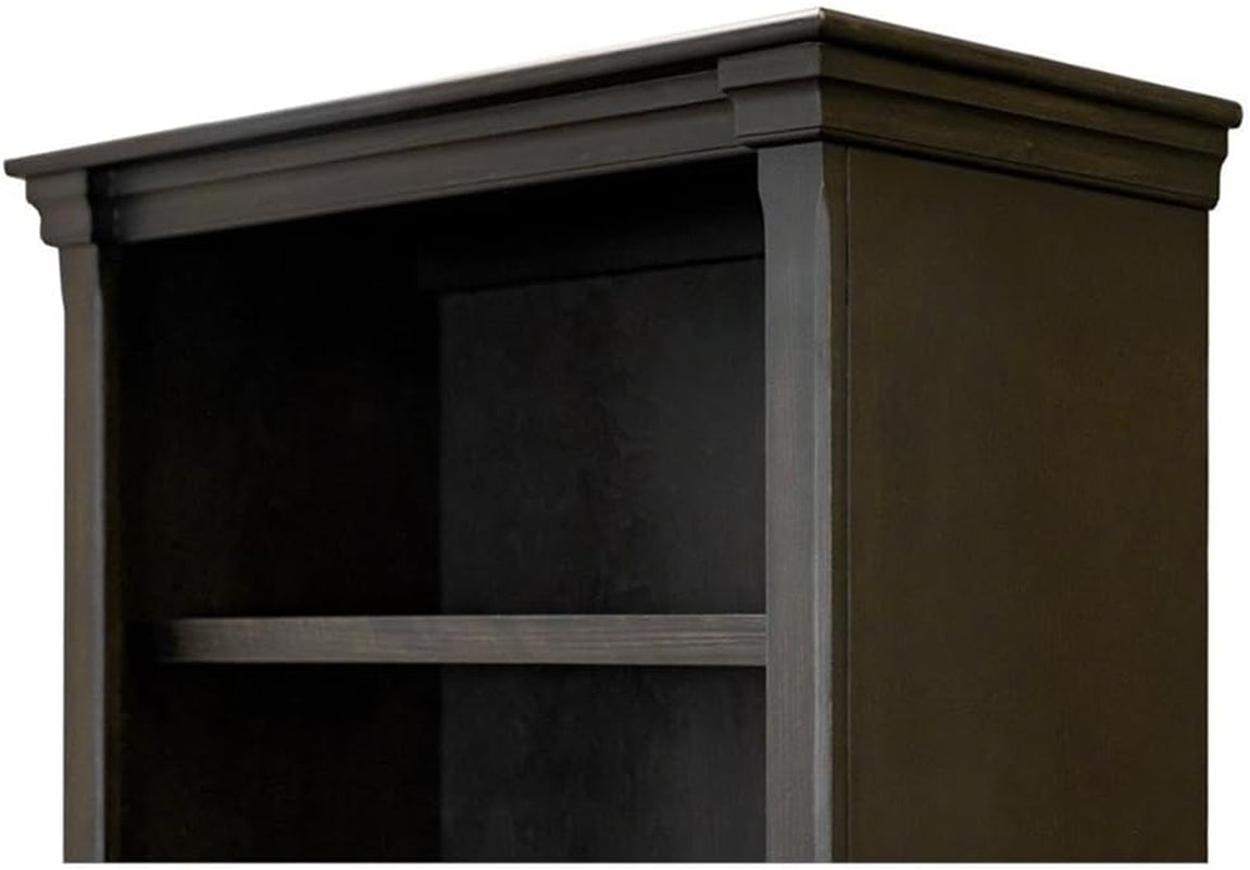 Close-up of distressed dark brown bookcase top molding and shelf edge showing crown trim and finish