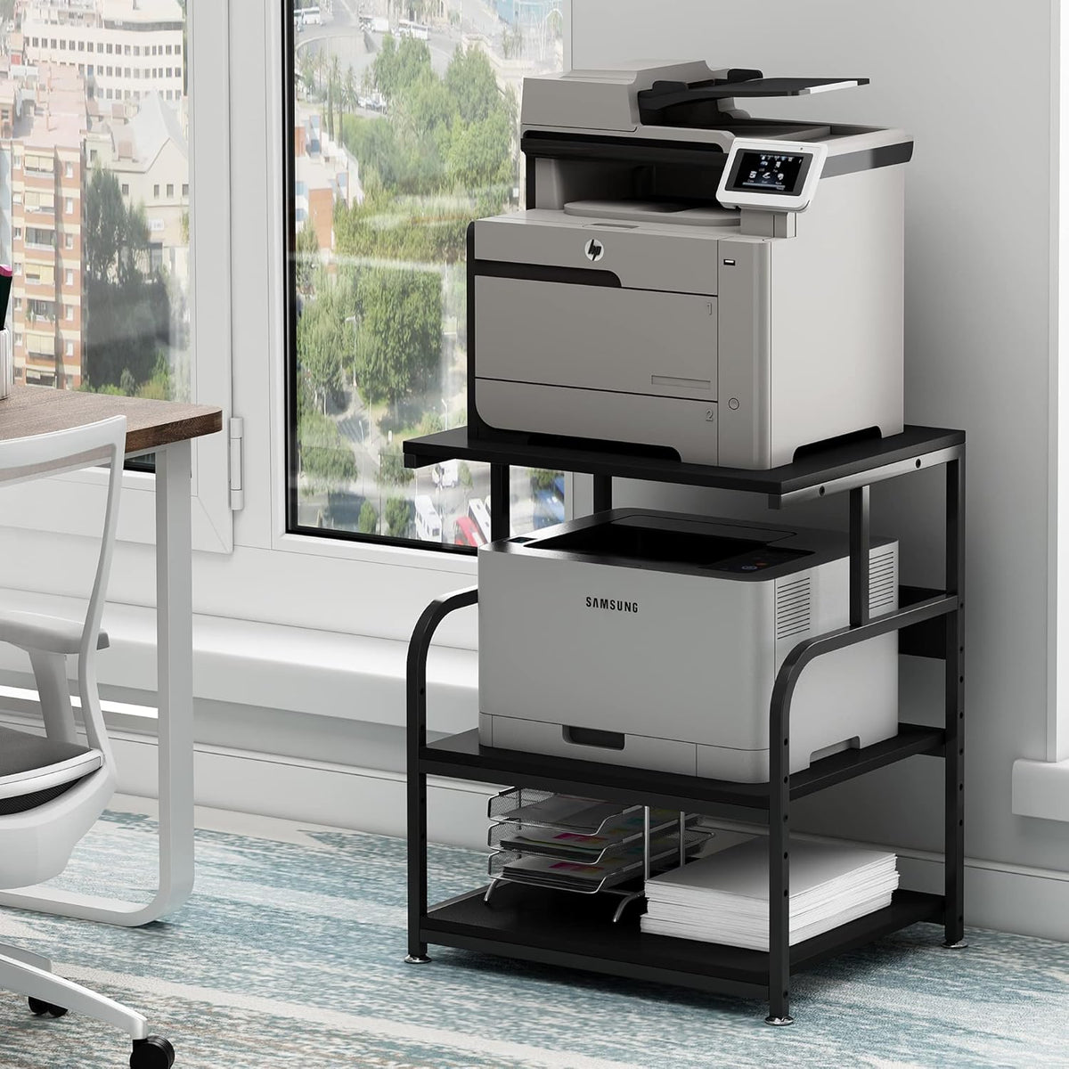 Black 3-tier printer stand front-right view with printers on top and middle shelves by a window