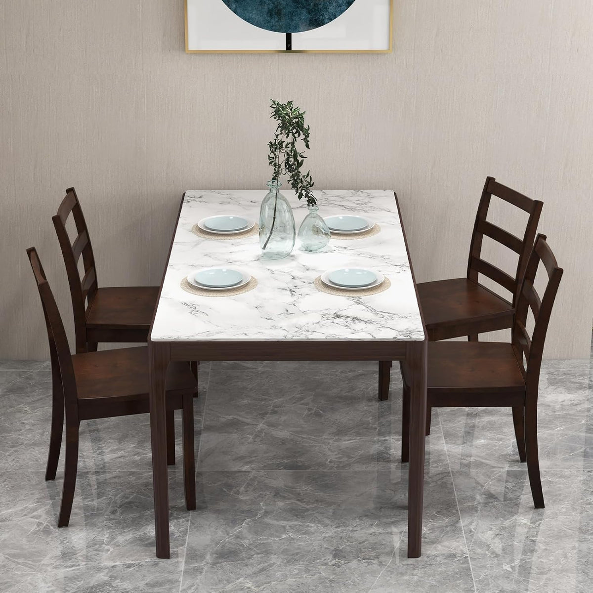 Four brown ladder-back chairs arranged around a white marble-look dining table.