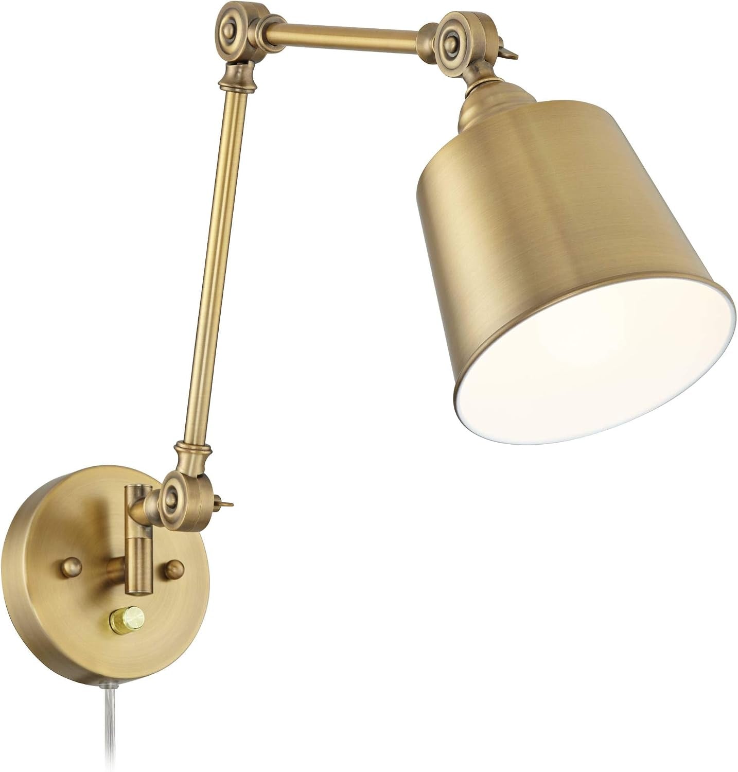 Angled view of the adjustable brass arm and lit white-lined shade with round wall plate.