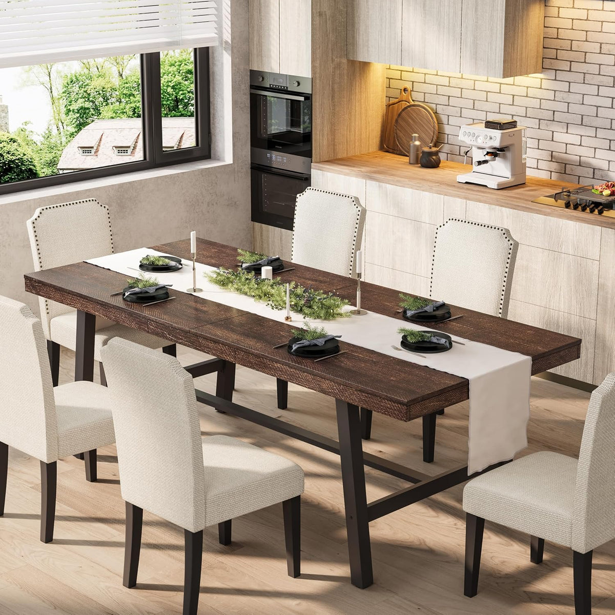 Dark wood extendable table with black metal trestle base set with white runners and upholstered dining chairs.